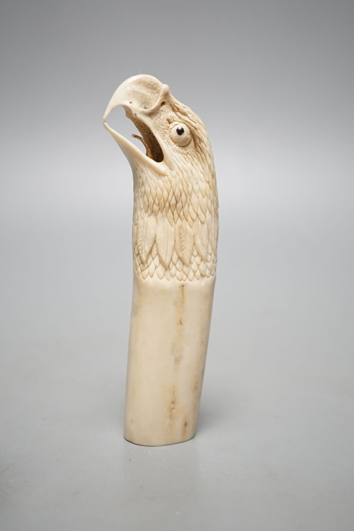 Two Japanese stag horn handles - eagle's head and a memento mori, eagle-head 13.5 cms high.